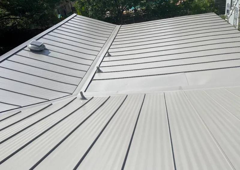 Solar attic fan installed on a metal roof for Roof Ventilation in New Hope